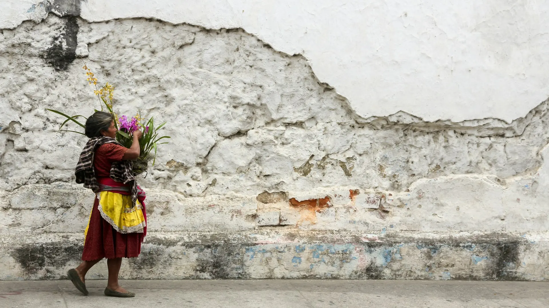 woman carrying flowers